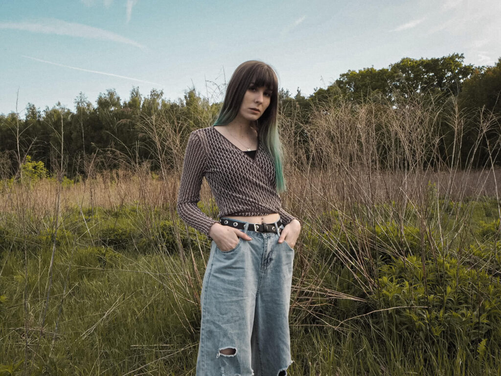 2000s style: wrap top with relaxed fit jeans and gucci boat